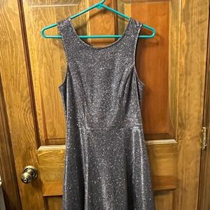 Sparkly black party dress with tie back